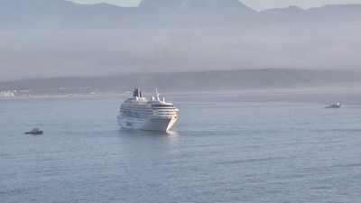 Cruise ship arrives in beautiful, misty morning in Mossel Bay