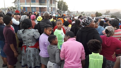Crowd march to Velile Waxa's house