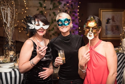 Masks don't hide smiles at ball
