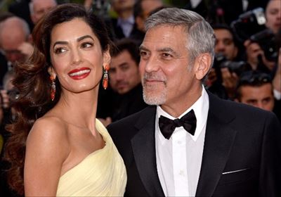George and Amal Clooney donate $1 million
