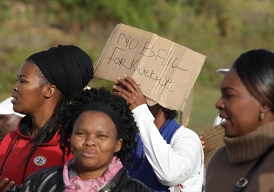 Rally against bail for 'spade killer'