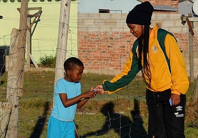 Female police soccer players reach out