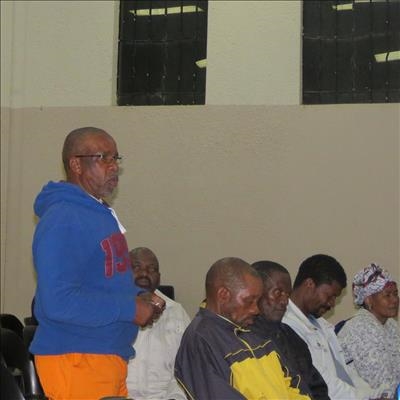 Unhappy community meet with police