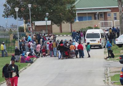 Hundreds queue hoping for distress grant