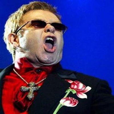 Elton John dedicates AIDS benefit to the late Liz Taylor