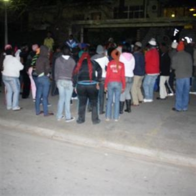 Protestors throw stones, block roads