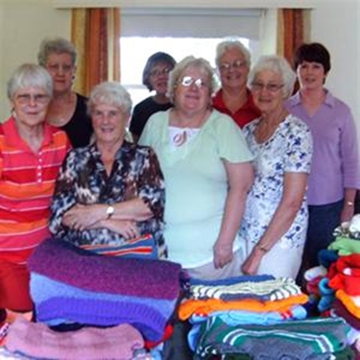 Their knitting softens winter's blow