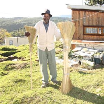 The man behind the brooms