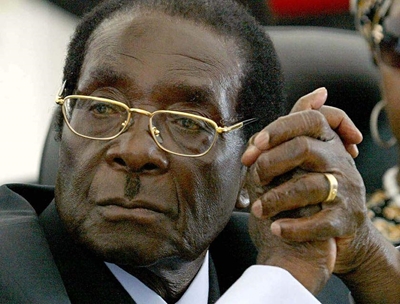 Defiant Mugabe sworn in for new term