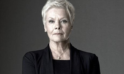 Firefighers serenade Judi Dench in London