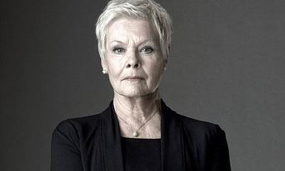 Firefighers serenade Judi Dench in London