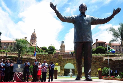 Zuma unveils statue of smiling Mandela