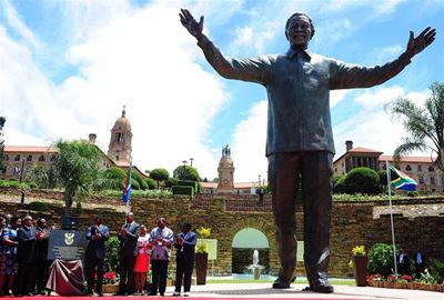 Zuma unveils statue of smiling Mandela