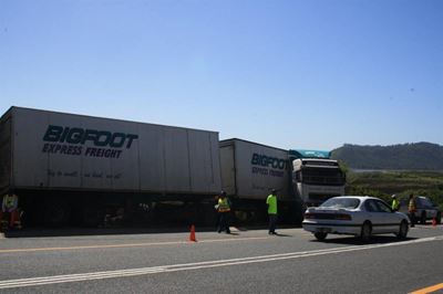 Truck jack-knifes after swerving for pedestrian