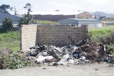 Refuse dump on doorstep stinks