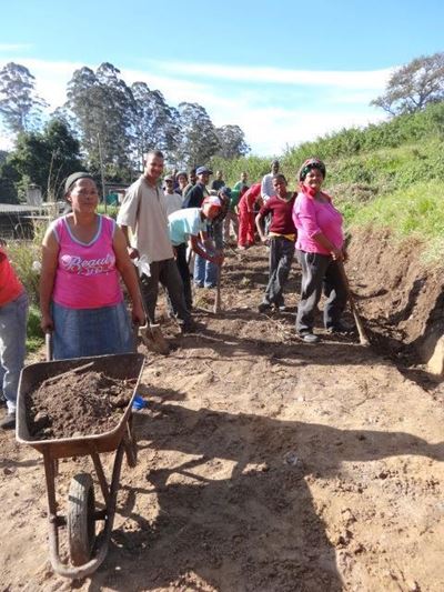 Community comes together to fix road