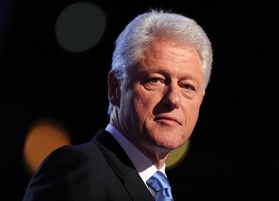 Bill Clinton defends wife's commitment to poor