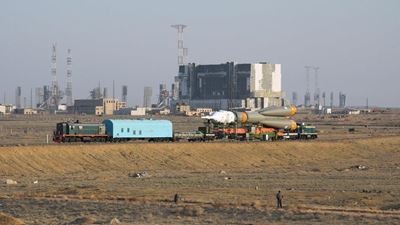 Russian cargo craft docks with ISS, science satellite falls