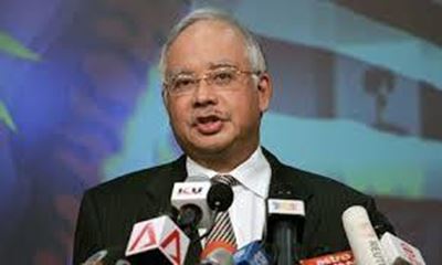 Malaysia observes day of mourning as MH17 victims return home