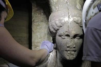 Greek excavation reveals statues, fuelling speculation over tomb