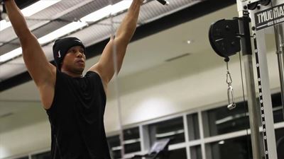 Woods says strength is back, but not swing