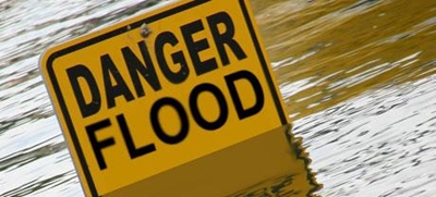 Warning against vandalising flood signage