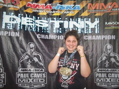 Local fighter wins triple gold
