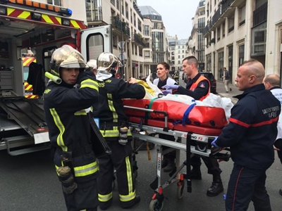 Masked gunmen cause panic in Paris, leaving 12 dead