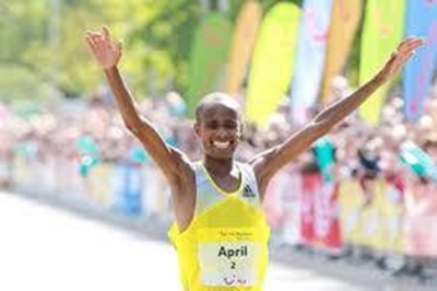 April to carry sa flag at Boston Marathon