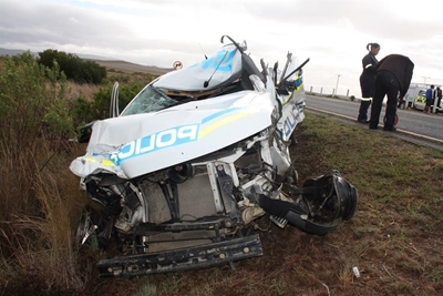 Suspect steals police van, causes accident