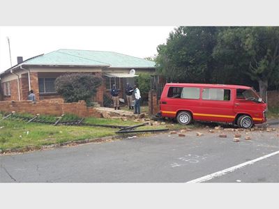 Taxi crashes into home