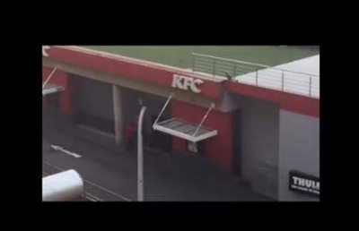 KFC workers sharpen knives on pavement