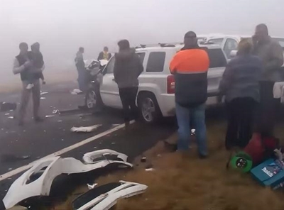 More than 65 vehicles crash in heavy mist
