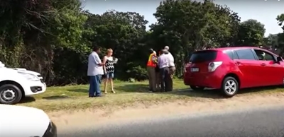 Traffic cops cuff woman in front of her child