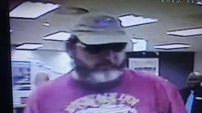 Robber threatens to blow up bank with hand grenade