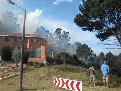 Update: Fire threatens residential areas