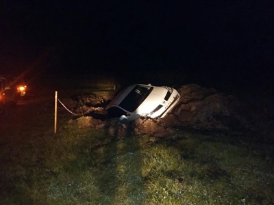 Car lands in hole