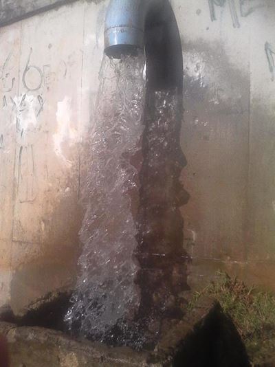 Flooding water pours into home