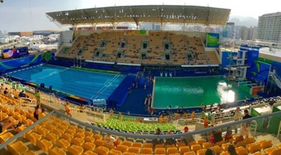 Olympic swimming pool turns green