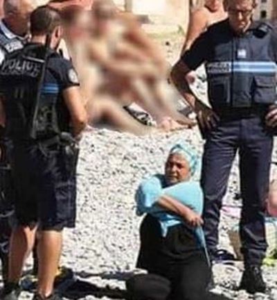 Burkini ban: Police force woman to remove part of clothing
