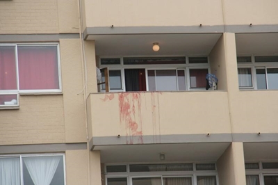 Murdered man thrown from flat window