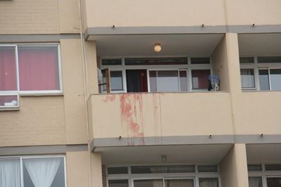 Murdered man thrown from flat window
