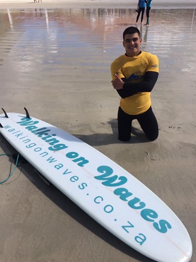 Shark attack victim surfs with champions