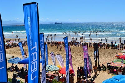 Touch rugby action on the beach