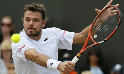 Wawrinka advances, Berdych stunned