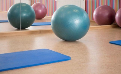 Use an exercise ball to help flatten your tummy