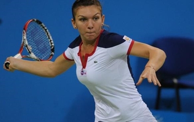 Halep battles back to oust Vinci in Madrid