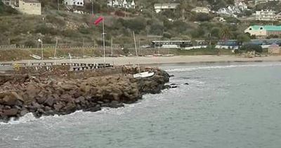 Hobie cat on the rocks