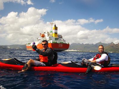 Kayakers in rough seas for good cause