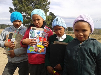 Beanies and pens for children